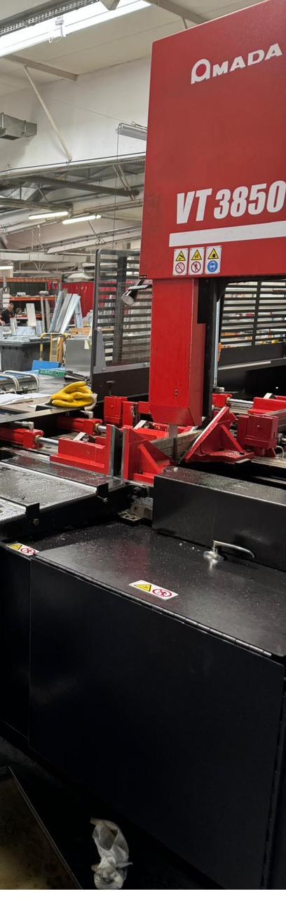 Operator at Amada VT3850 bandsaw